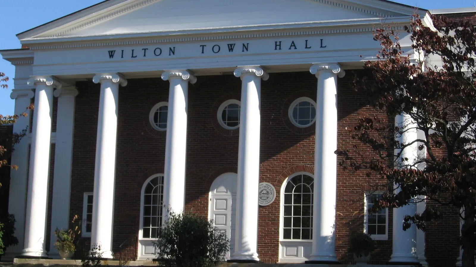 Wilton Town Hall, a brick Greek Revival building with white columns, Wilton, Connecticut